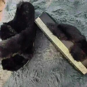 Women's black fur and rhinestone slippers